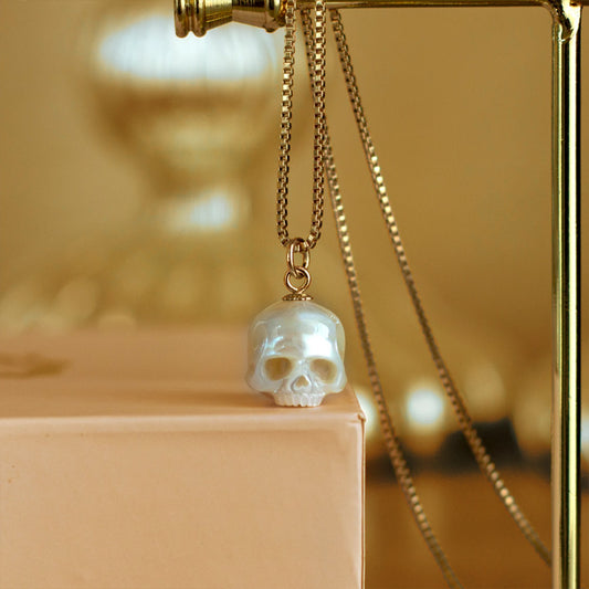 Hand Carved Pearl Skull Necklace